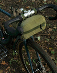 Two cycling bags attached with magnetic fastenings, rural setting.